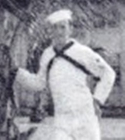 Leon in 1941 photo; in Dress Whites leaning against a Palm Tree